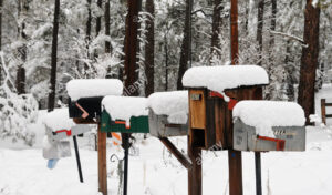 mailboxes-in-a-row-on-a-snowy-winter-day-in-flagstaff-arizona-AW4JJY