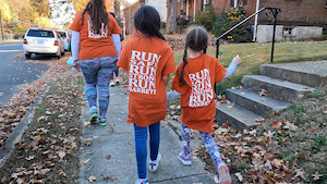 barret students running with orange barret on the run shirts