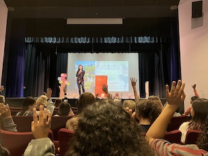 author reading on stage